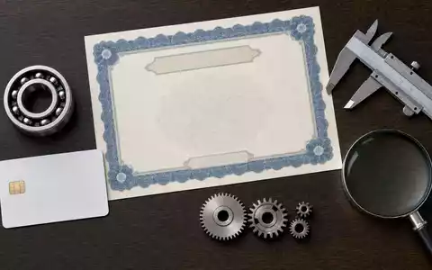 Schaeffler AG (DE000SHA0100) als Aktienanlage gezeigt durch Flatlay mit Zertifikat, ISIN-Karte, Kugellager und Präzisionswerkzeug - Foto: THN