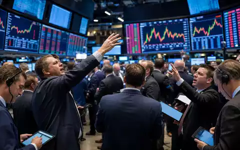 Editorial-Aufnahme eines Börsenparketts mit Charts symbolisiert Handelsaktivität rund um T. Rowe Price Group, ISIN US74144T1088 - Foto: THN