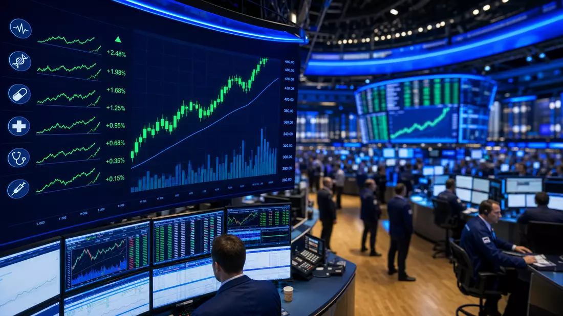 Redaktionelles Foto des Nasdaq-Börsenhandelsraums mit grünen Medizintechnik-Kurscharts auf Screens