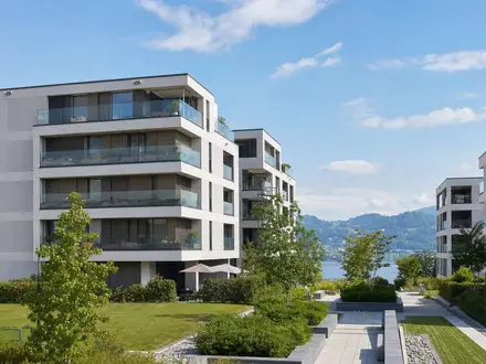 Fotorealistische Wohnüberbauung am See symbolisiert Mobimo Holding AG CH0011108872 im Schweizer Immobilienmarkt - Foto: THN