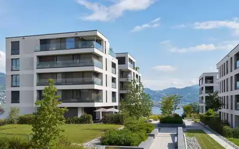 Fotorealistische Wohnüberbauung am See symbolisiert Mobimo Holding AG CH0011108872 im Schweizer Immobilienmarkt - Foto: THN