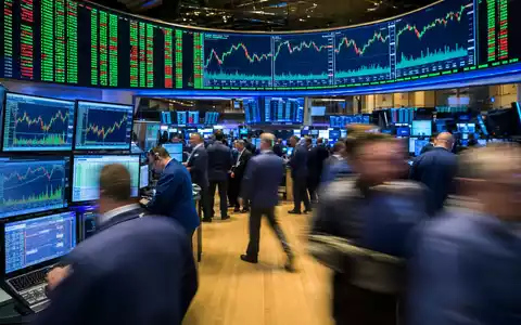 Illumina Inc. NASDAQ-Börsenparkett US4523271090 mit aktiven Händlern und Biotech-Sektor-Charts auf beleuchteten Großbildschirmen - Foto: THN