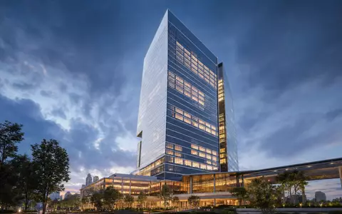 Capital One Financial Konzernhochhaus – Architektur-Render im Zwielicht mit Glasfassade, ISIN US1381731035 - Foto: THN
