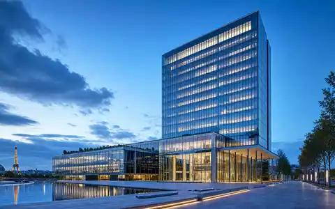Vivendi SE (FR0000127771) unterhält moderne Bürokomplexe; dieser Render zeigt einen Glasturm in Paris am Abend - Foto: THN