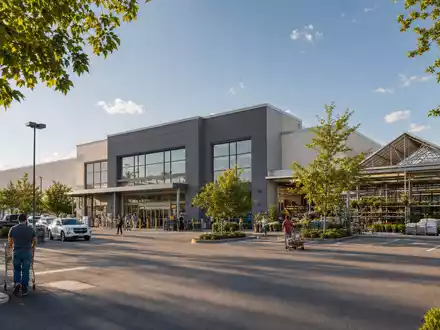 Hornbach Holding DE0006083405 zeigt modernes Baumarkt-GebÀude mit Gartencenter und Parkplatz im Sonnenlicht - Foto: THN