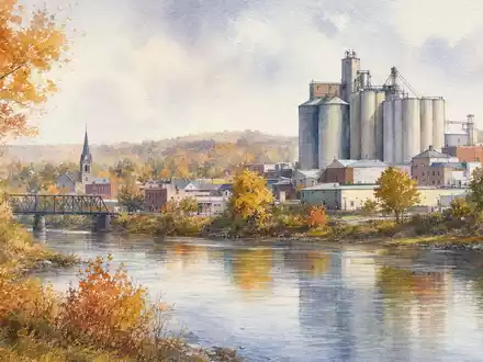 Hormel Foods US4404521001 – Aquarellmalerei der Midwest-Kleinstadt Austin mit Getreidesilos am Fluss - Foto: THN