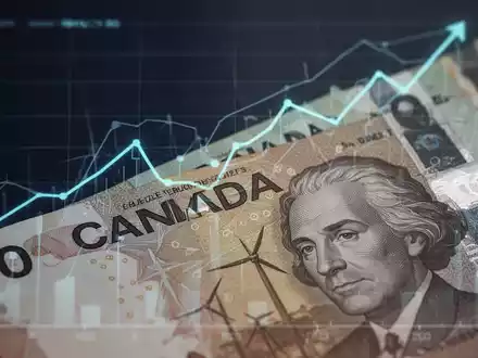 Nahaufnahme von kanadischen Dollar-Banknoten mit einem subtilen aufsteigenden Diagramm im Hintergrund, das finanzielles Wachstum darstellt. - Foto: über boerse-global.de