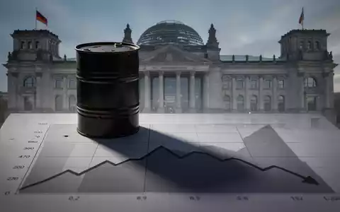 Ein stilisierter Ölfassschatten auf einem abwärts gerichteten Finanzchart mit dem Bundestag im Hintergrund. - Foto: über boerse-global.de