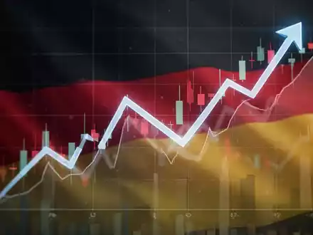 Grafische Darstellung eines fallenden Finanzcharts mit angedeuteter deutscher Flagge im Hintergrund, symbolisiert sinkende Körperschaftsteuer. - Foto: über boerse-global.de