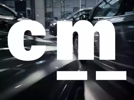 Eine dynamische, abstrakte Szene, die den Automobil-Einzelhandel darstellt, mit Fokus auf Licht, Schatten und Bewegung. - Foto: über boerse-global.de