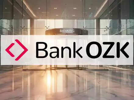 Moderne Bankarchitektur mit warmem Licht, die finanzielle Stabilität und Wachstum symbolisiert. - Foto: über boerse-global.de