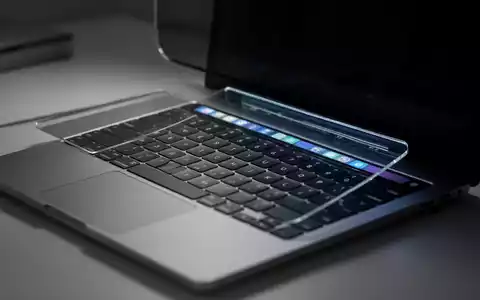 Nahaufnahme einer MacBook Pro-Tastatur und Touch Bar in einem modernen, schwach beleuchteten Büro. - Foto: über boerse-global.de
