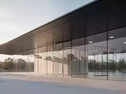 Minimalistische, moderne Architektur des Apple Park Besucherzentrums mit charakteristischem Carbonfaser-Dach. - Foto: über boerse-global.de