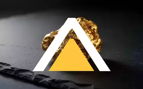 Ein goldener Nugget auf einem dunklen, strukturierten Steinuntergrund in einer professionellen, atmosphärischen Aufnahme. - Foto: über boerse-global.de
