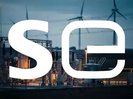 Abstrakte Darstellung einer modernen Energieinfrastruktur mit Windkraftanlagen bei Dämmerung. - Foto: über boerse-global.de