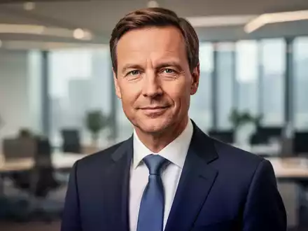 Ein professionelles Porträt eines Politikers in einem modernen Bürogebäude als Symbol für die deutsche Gesundheitspolitik. - Foto: über boerse-global.de