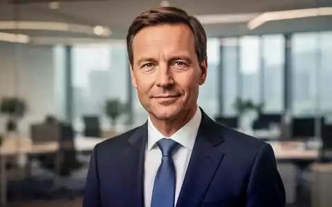 Ein professionelles Porträt eines Politikers in einem modernen Bürogebäude als Symbol für die deutsche Gesundheitspolitik. - Foto: über boerse-global.de