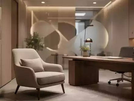 Ein minimalistisches, modern eingerichtetes Psychotherapie-Büro mit weicher Beleuchtung und einem Therapiesessel. - Foto: über boerse-global.de