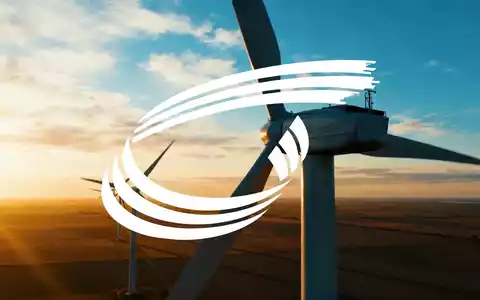 Moderne Windkraftanlagen in einer weiten Landschaft bei Sonnenuntergang als Symbol für erneuerbare Energien. - Foto: über boerse-global.de