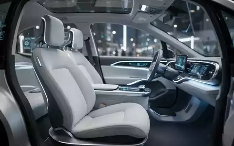 Innenraum eines autonomen Robotaxis ohne Lenkrad oder Bremspedale, minimalistisches Design. - Foto: über boerse-global.de