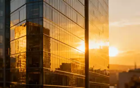 Moderne Büroarchitektur im Sonnenlicht als Symbol für finanzielles Wachstum und Dividendenstabilität. - Foto: über boerse-global.de