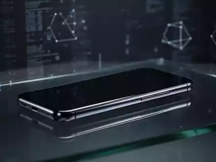 Schlankes, hochwertiges Smartphone-Silhouette auf dunkler Glasfläche mit weicher, filmischer Beleuchtung. - Foto: über boerse-global.de