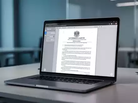 Ein Laptop-Bildschirm zeigt ein digitales Dokument eines Bundesgesetzblatts in einer modernen, professionellen Arbeitsumgebung. - Foto: über boerse-global.de