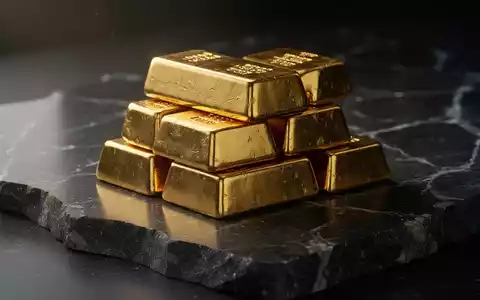 Goldbarren auf dunklem Untergrund als Symbol für den ghanaischen Goldmarkt - Foto: über boerse-global.de
