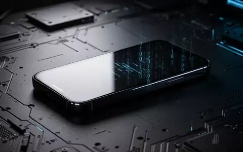 Modernes Smartphone auf einem dunklen Technik-Tisch mit subtilen digitalen Reflexionen. - Foto: über boerse-global.de