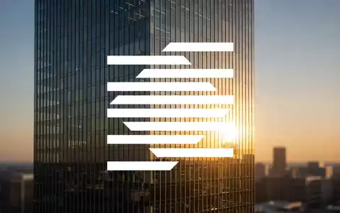 Abstrakte Darstellung eines modernen Bürogebäudes im goldenen Morgenlicht als Symbol für finanzielles Wachstum und Stabilität. - Foto: über boerse-global.de