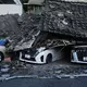 Viele Häuser in der Katastrophenregion sind zerstört.   - Bild: Hiro Komae/AP/dpa