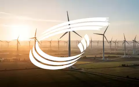 Moderne Windkraftanlagen in einer weiten Landschaft bei Sonnenaufgang, symbolisch für erneuerbare Energien. - Foto: über boerse-global.de
