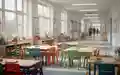 Ein moderner, heller Klassenraum einer Grundschule mit bunten Möbeln und Lernmaterialien. - Foto: über boerse-global.de