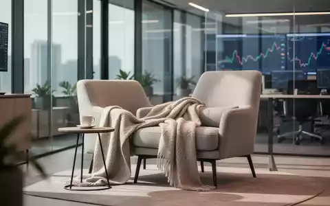 Ein moderner, heller Büroraum mit einem bequemen Sessel, der eine entspannte Atmosphäre für kurze Pausen ausstrahlt. - Foto: über boerse-global.de