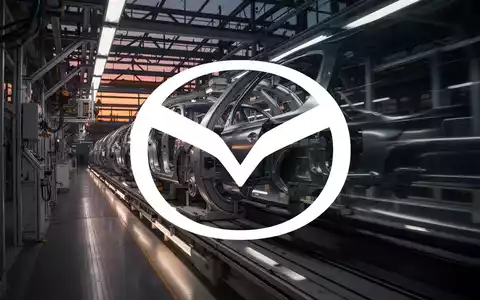 Moderne, elegante Fertigungslinie in der Automobilindustrie bei atmosphärischer Beleuchtung. - Foto: über boerse-global.de