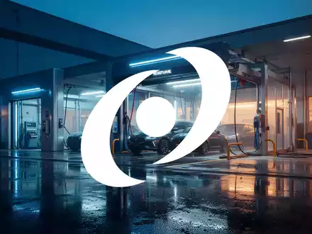 Moderne, industriell geprägte Waschstraße in atmosphärischer Abendbeleuchtung als Symbol für den Industriesektor - Foto: über boerse-global.de