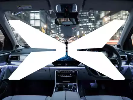 Abstraktes Bild eines futuristischen autonomen Fahrzeuginnenraums mit Fokus auf moderne Sensortechnik und urbanes Design. - Foto: über boerse-global.de