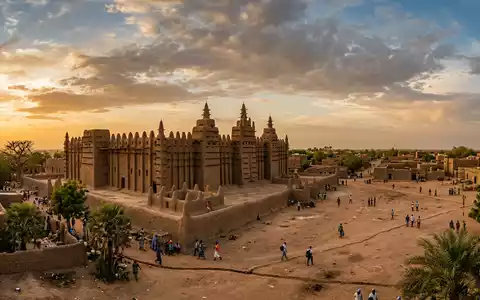 Fotorealistische Panoramaaufnahme von Grosse Moschee von Djenne in Djenne Mali, warmes Abendlicht auf Wahrzeichen - Foto: THN