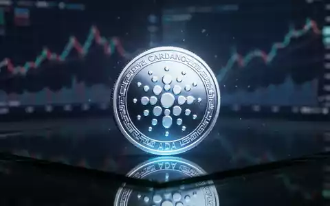 Digitales Cardano-Symbol auf einer glänzenden Oberfläche mit unscharfen Finanzdiagrammen im Hintergrund. - Foto: über boerse-global.de
