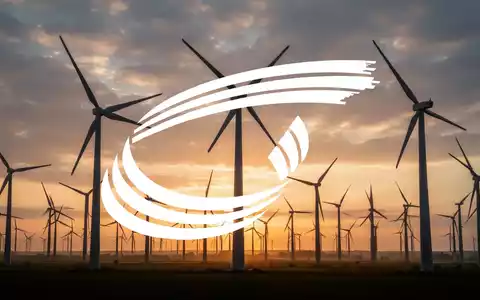 Moderne Windkraftanlagen in einer weiten Landschaft bei Sonnenuntergang als Symbol für den Ausbau erneuerbarer Energien. - Foto: über boerse-global.de