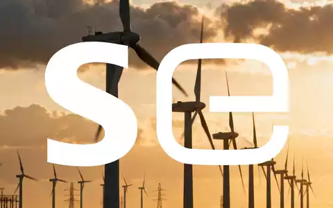 Moderne Windkraftanlagen in einer weitläufigen Industrielandschaft bei Sonnenuntergang - Foto: über boerse-global.de