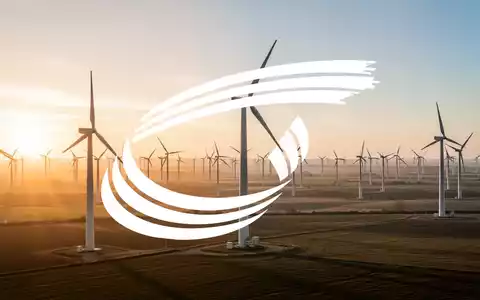 Moderne Windkraftanlagen in einem weitläufigen Windpark bei Sonnenuntergang als Symbol für erneuerbare Energien. - Foto: über boerse-global.de