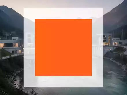 Modernes Wasserkraftwerk in einer alpinen Flusslandschaft bei Sonnenaufgang als Symbol für nachhaltige Energieerzeugung. - Foto: über boerse-global.de