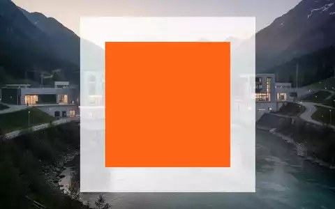 Modernes Wasserkraftwerk in einer alpinen Flusslandschaft bei Sonnenaufgang als Symbol für nachhaltige Energieerzeugung. - Foto: über boerse-global.de