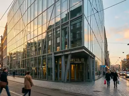 Moderne Glasfassade eines Bankgebäudes in einem Finanzviertel bei Sonnenuntergang. - Foto: über boerse-global.de
