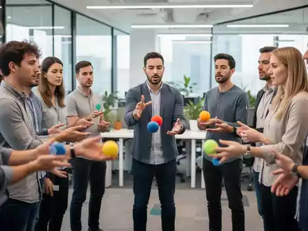 Eine Gruppe von Mitarbeitern in einem modernen Büro beim Jonglieren zur Steigerung der kognitiven Resilienz. - Foto: über boerse-global.de