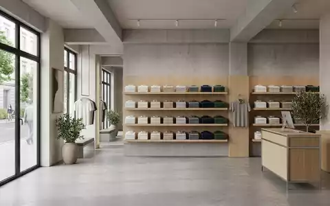 Architektur-Render im Bekleidungsgeschäft mit Kurzarm-Kragenhemd zum Thema Polo Ralph Lauren Shirt, ISIN US7512121010, neutrales Tageslicht - Foto: THN
