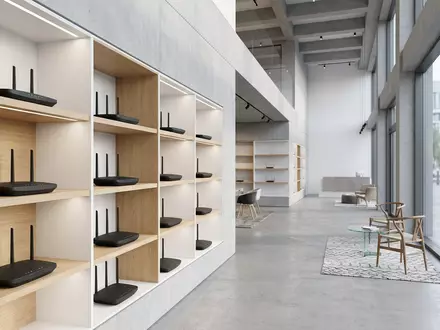 Architektur-Render im Elektronik-Fachmarkt mit WLAN-Router zum Thema Netgear Nighthawk Router, ISIN US64111Q1040, neutrales Tageslicht - Foto: THN