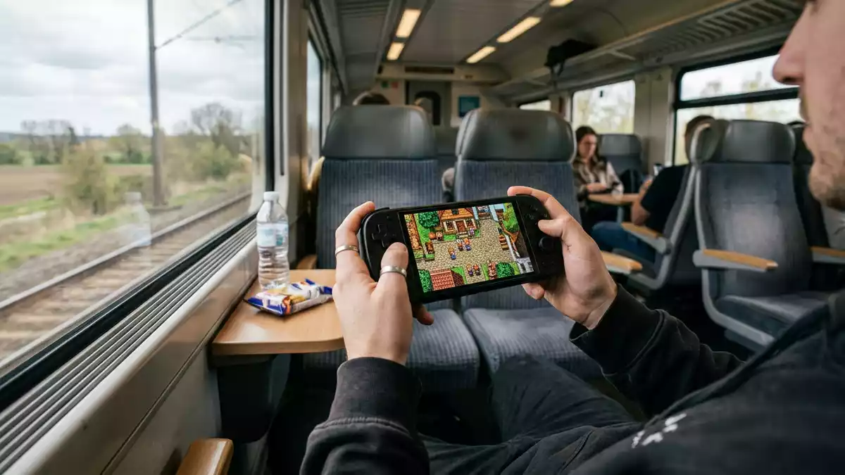 Fotorealistische Ansicht von Handheld-Konsole auf Reisen in realer Umgebung, neutral