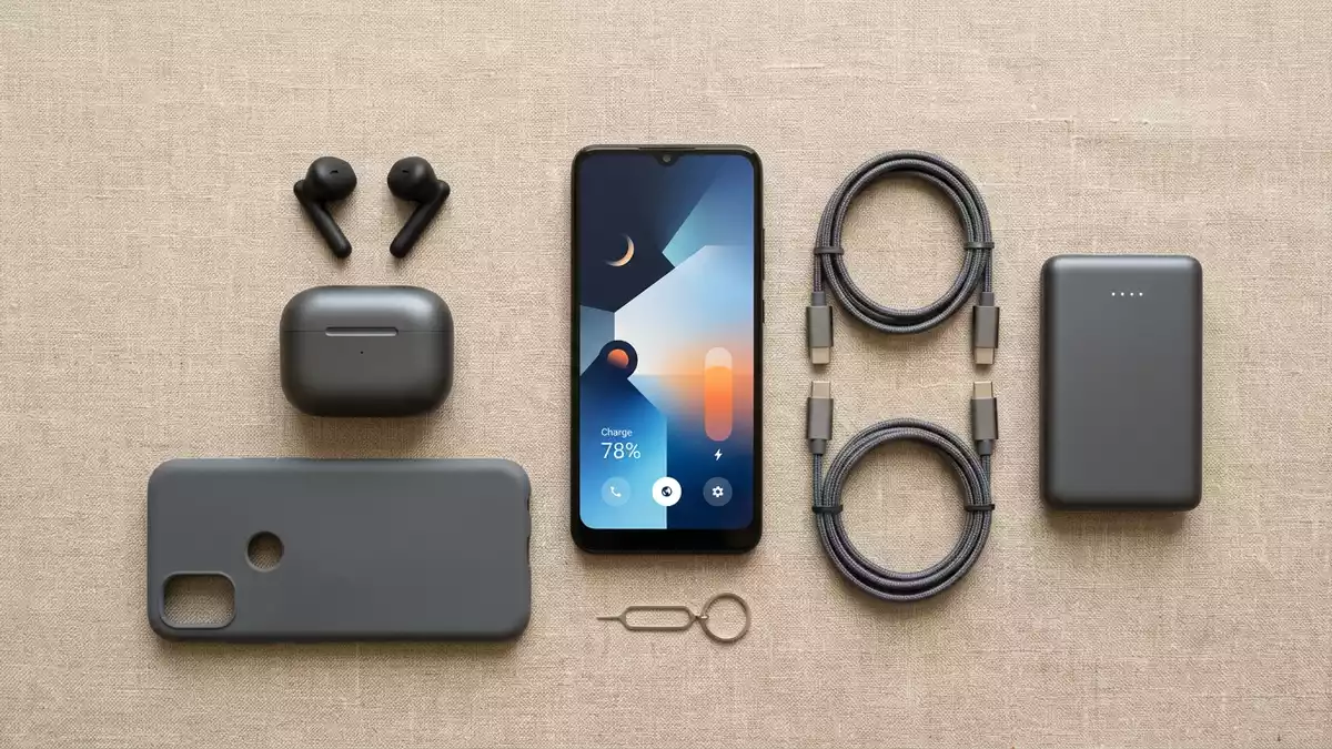 Flatlay-Arrangement rund um Smartphonevertrag mit passenden Requisiten von oben
